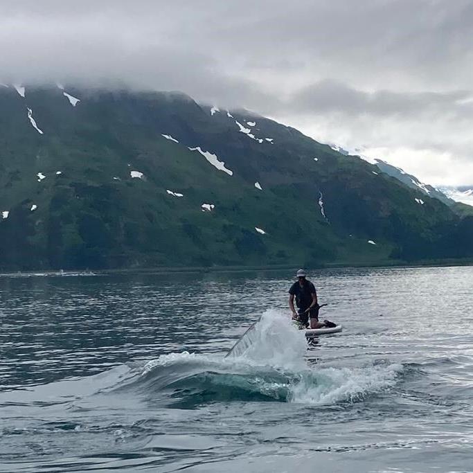 See how an Alaska paddleboarder escaped a close encounter with a humpback whale